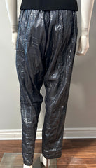 Suzie Kondi gunmetal shine pants in size M/L, stylish metallic clothing with a sleek fit, shown on a model.