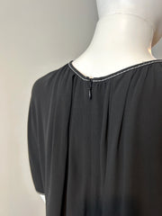 Marni black tunic in size 42/8 displayed on a hanger, showcasing the stylish, relaxed fit and elegant fabric.