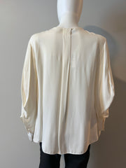 Fendi cream blouse size 40/6, elegant women's clothing with a soft fabric and stylish design, displayed on a hanger.