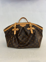 Louis Vuitton Monogram Tivoli GM bag with leather handles and gold hardware, showcasing the iconic monogram canvas.