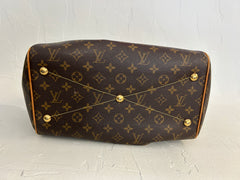 Louis Vuitton Monogram Tivoli GM bag with top handles, featuring the iconic LV monogram pattern and spacious interior.