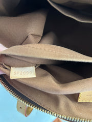 Louis Vuitton Monogram Tivoli GM bag featuring classic monogram canvas, leather handles, and spacious interior.