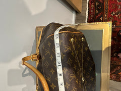 Louis Vuitton Monogram Tivoli GM bag with leather handles and spacious interior, featuring the iconic LV monogram canvas.