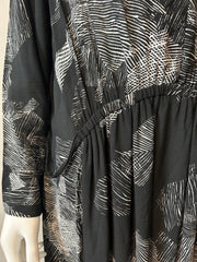 Raquel Allegra XL graphic print dress displayed on a hanger, showcasing its vibrant design and relaxed fit.
