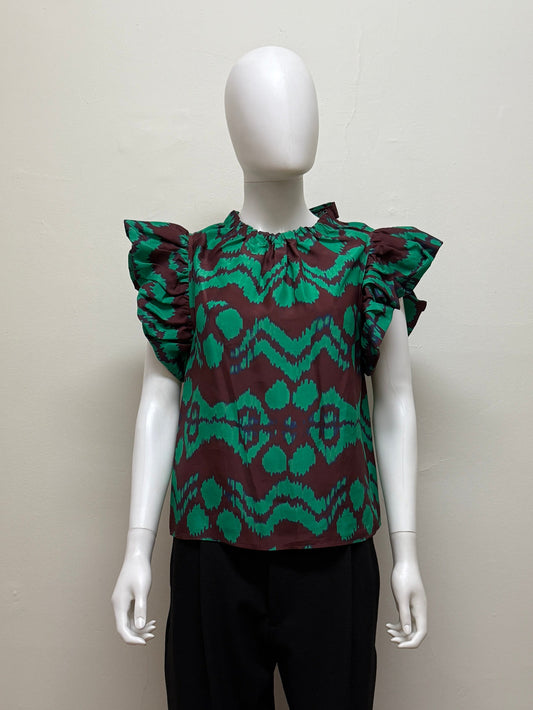 Ulla Johnson Iren Silk Blouse in light fabric with delicate details, shown on a hanger or model, highlighting its elegant design.