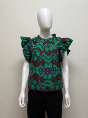 Ulla Johnson Iren Silk Blouse in light fabric with delicate details, shown on a hanger or model, highlighting its elegant design.