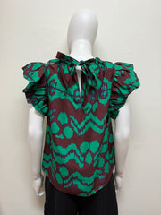 Ulla Johnson Iren silk blouse in a soft, flowing fabric with a relaxed fit and delicate detailing, worn by a model.