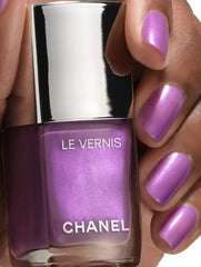 Chanel Vernis Nail Colour bottles in various shades, featuring sleek packaging and vibrant, glossy finish for beautiful nails.