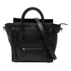 Celine Nano Leather Luggage Tote in beige with top handles and structured design, displayed on a neutral background.