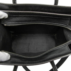 Celine Nano Leather Luggage Tote in beige with structured design and top handles, showcasing premium leather craftsmanship.