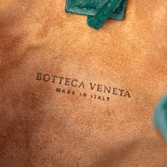 Bottega Veneta small green pony hair drop bucket bag with sleek design and shoulder strap, stylish and luxurious accessory.