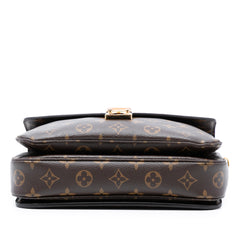 Louis Vuitton Monogram Pochette Metis bag in brown leather with signature LV monogram pattern and gold hardware.