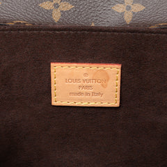 Louis Vuitton Monogram Pochette Metis bag in brown leather with signature LV monogram pattern and gold hardware.