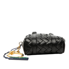 Black Bottega Veneta Nappa Intrecciato pouch and key holder with bag charm, featuring woven leather design and compact accessory style.