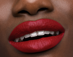 Christian Louboutin On The Go Les Rouges lipstick set with vibrant red shades, displayed in a sleek compact container.