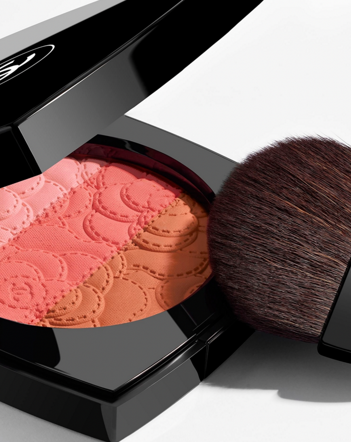Chanel Camélia Futura powder blush trio in a sleek compact with three shades for a natural, radiant makeup look.
