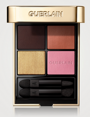 Guerlain Ombres G quad eyeshadow palette with four shades in a sleek compact, featuring neutral and warm tones.