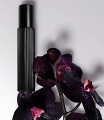 Tom Ford Black Orchid Eau de Parfum travel spray featuring black truffle and ylang ylang, showcasing elegant fragrance packaging.