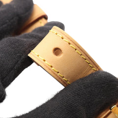 Louis Vuitton Monogram Odeon PM brown bag with dual top handles and gold-tone hardware, showcasing classic LV monogram canvas.