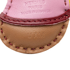 Hermès Milo Lambskin Geegee Camail Bag Charm in pink, featuring soft lambskin leather and detailed craftsmanship.