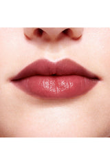 Dior Addict Lip Glow 48-Hour Hydrating Lip Balm in shade 104 Black Cherry, pH-activated color, new in box.