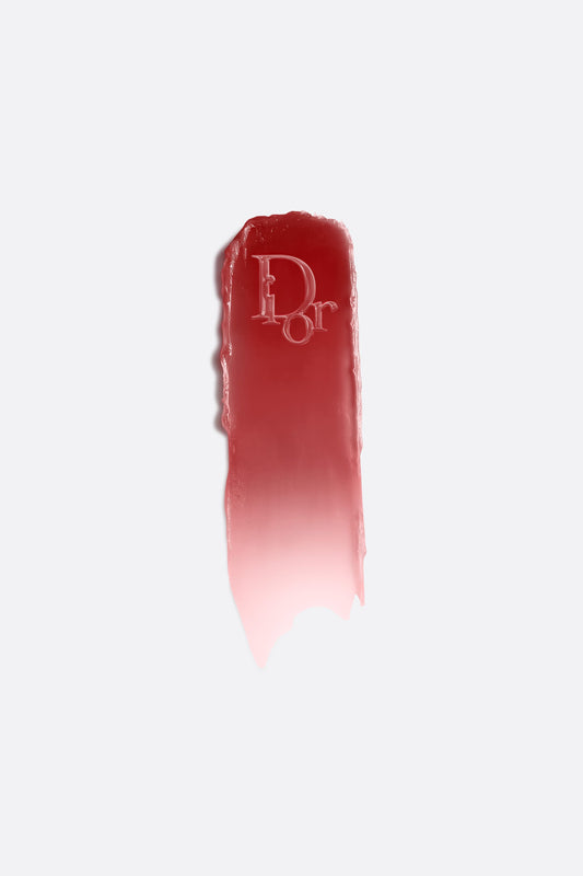 Dior Addict Lip Glow hydrating lip balm in shade 104 Black Cherry, pH-activated color, showcasing the sleek black tube and product.