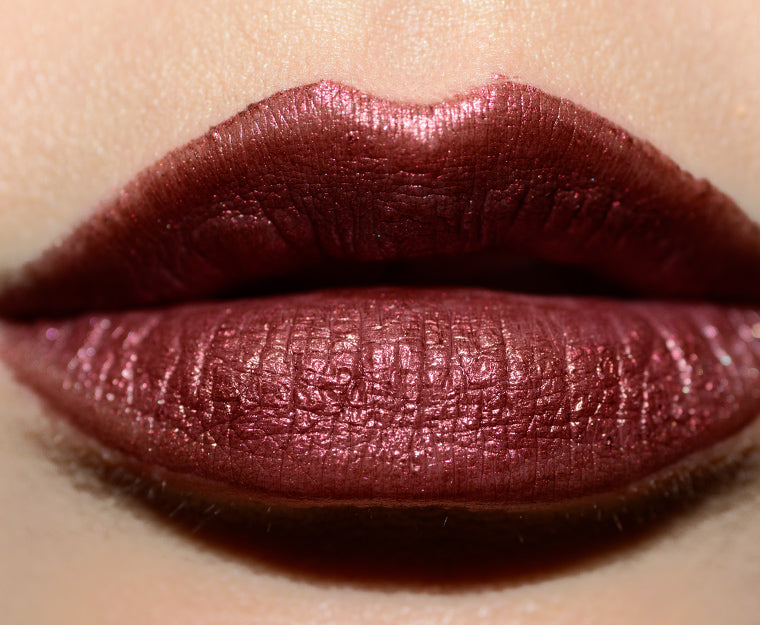 Chanel Rouge Allure Laque lipstick in Fancy Prune shade, featuring smooth, glossy lips with rich plum color.