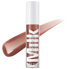 Milk Makeup Odyssey Hydrating Lip Oil Gloss in shades, non-sticky formula, glossy finish, new in box, shown in daytime lighting.