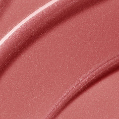 Rare Beauty Positive Light Luminizing Lip Gloss in various shades, new in box, glossy finish, natural light reflection.