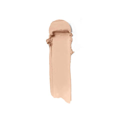 Swatch of ILIA Skin Rewind Blurring Foundation and Concealer Complexion Stick in various shades, displayed on a hand.