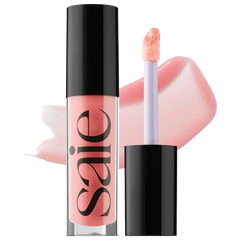 Saie Glossybounce™ high-shine hydrating lip gloss oil swatched on lips, showcasing glossy finish and vibrant shades in beauty product image.