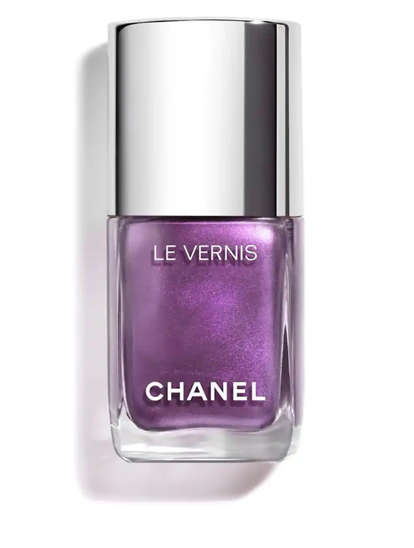 Chanel Vernis nail color bottles in various shades, showcasing sleek glass packaging and colorful nail polish inside.