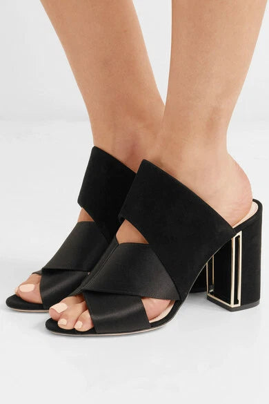 Black Nicholas Kirkwood Nini mules in size 38, featuring sleek design and pointed toe, displayed on a white background.