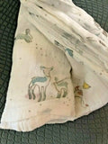 Pehr Springtime Friends baby swaddle blanket, 46x46 inches, featuring colorful spring-themed patterns on soft fabric.