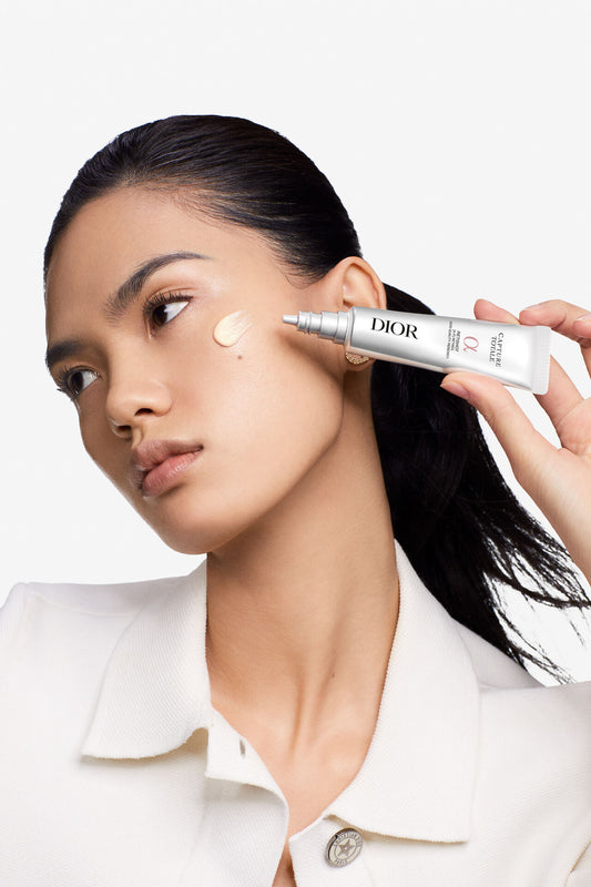 Dior Total Capture Retouch Stick in a sleek black makeup compact, designed for instant touch-ups and blemish concealment.