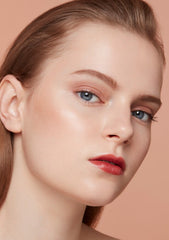 Clé de Peau Beauté Luminizing Face Enhancer in various shades, new in box, featuring a sleek compact with highlighter and blush options.