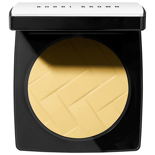 Bobbi Brown Vitamin Enriched Pressed Finishing Powder in Yellow, showing the compact with open lid and powder inside.