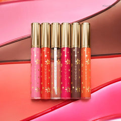 Gucci Gloss à Lèvres hydrating plumping lip gloss in various shades, new in box, featuring a shiny, smooth finish.