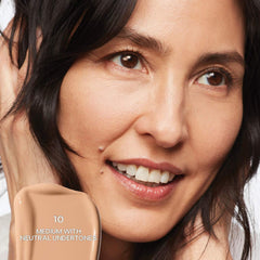 Saie Slip Tint Radiant All-Over Concealer in various shades, showing the compact tube with a doe-foot applicator and natural makeup finish.