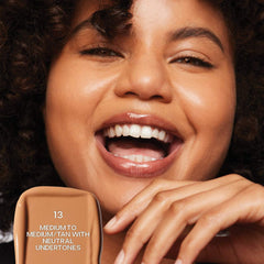 Saie Slip Tint Radiant All-Over Concealer in various shades, featuring a sleek tube with a black cap and product details.