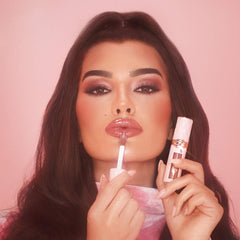 Charlotte Tilbury Big Lip Plumpgasm plumping lip gloss in unopened packaging, glossy finish, and applicator visible.