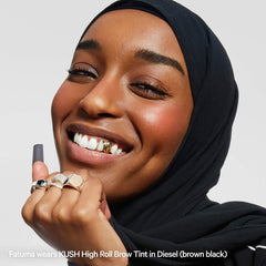 Milk Makeup Kush High Roll defining tubing eyebrow gel in various shades, featuring a close-up view of the product tube.
