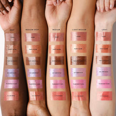 Fenty Beauty Gloss Bomb Stix high-shine lip gloss stick in various shades, featuring a smooth, glossy finish and sleek packaging.