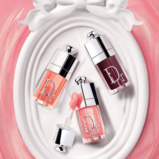 Dior Lip Glow Oil hydrating high-shine gloss in three finishes, displayed with the product bottle and applicator.