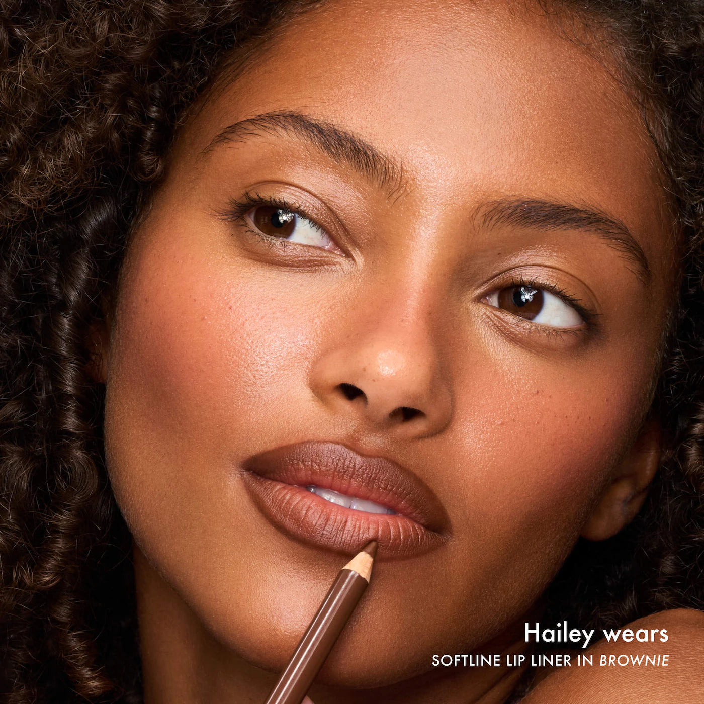 Summer Fridays SoftLine Lip Liner in various shades, creamy and sculpting, shown in close-up with the product tip visible.