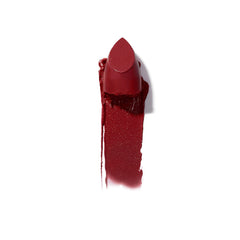 Ilia Color Block High Impact Lipstick in Tango shade, vibrant lipstick tube with open cap showing bold pink-red color.