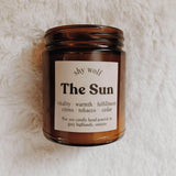 Shy Wolf Candles The Sun soy candle with citrus, tobacco, and cedar scents, designed for home decor.