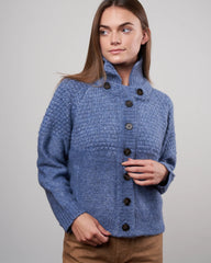 The Great shrunken hearth cardigan in saltwater blue, size S, displayed on a hanger showcasing its cozy, cropped design and soft fabric.