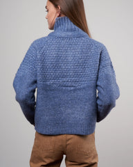Saltwater blue The Great shrunken hearth cardigan in size small, close-up of the cozy knit fabric and fitted style.