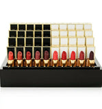 Tom Ford Boys & Girls Mini Lipsticks set with 50 assorted mini lipsticks in a beauty product display.